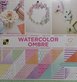 DCWV Watercolor Ombre paper pack with various patterns on a white background