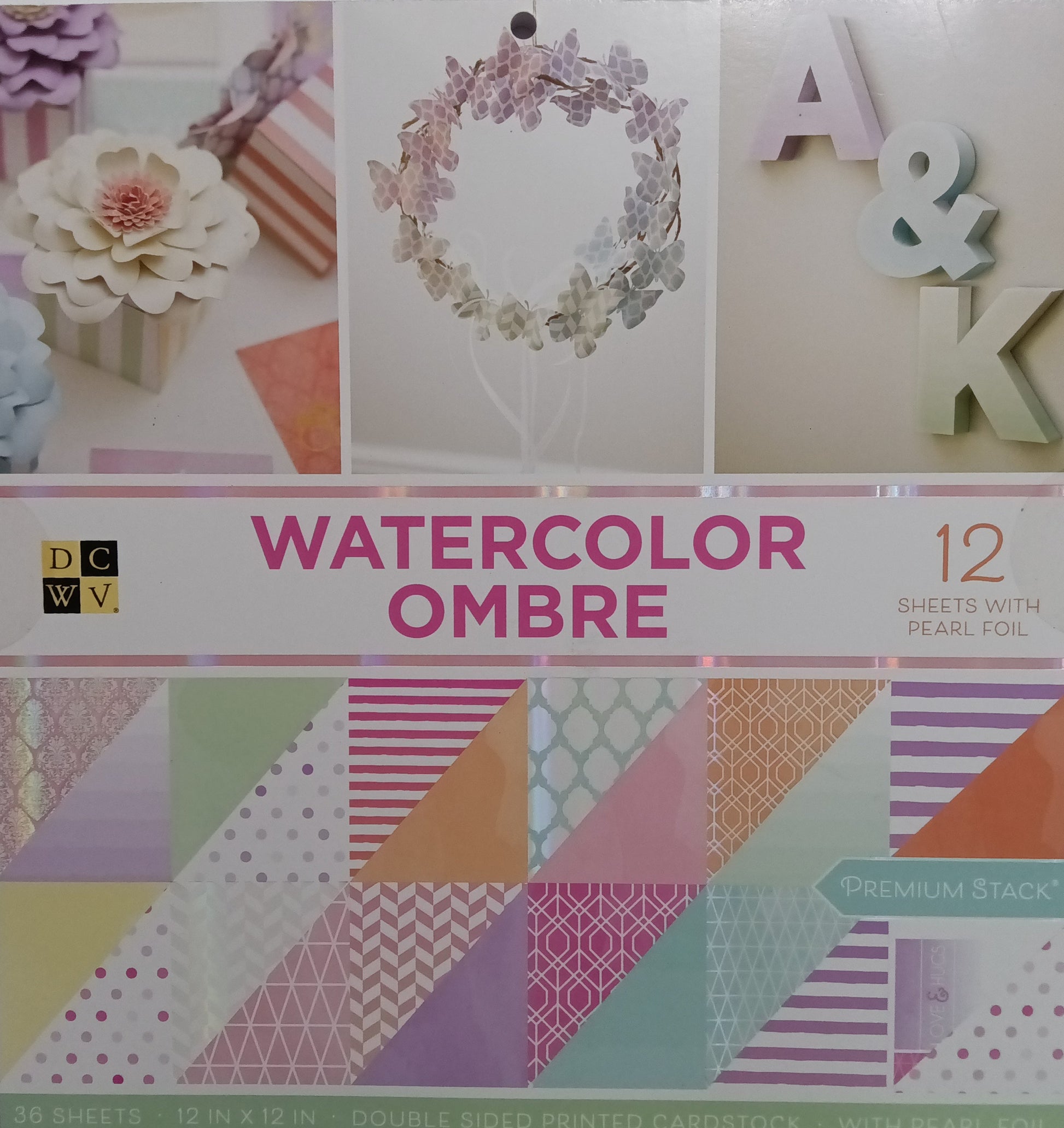 DCWV Watercolor Ombre paper pack with various patterns on a white background
