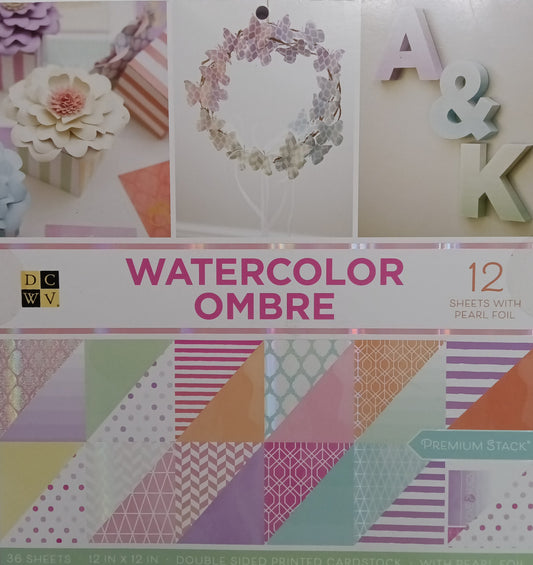 DCWV Watercolor Ombre paper pack with various patterns on a white background